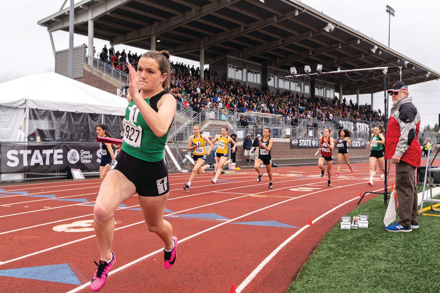 Tumwater's Reese Heryford takes off on the third leg of the 2A Girls 4x200 at the 4A/3A/2A State Track and Field Championships on Saturday, May 28, 2022, at Mount Tahoma High School in Tacoma. (Joshua Hart/For The Chronicle)